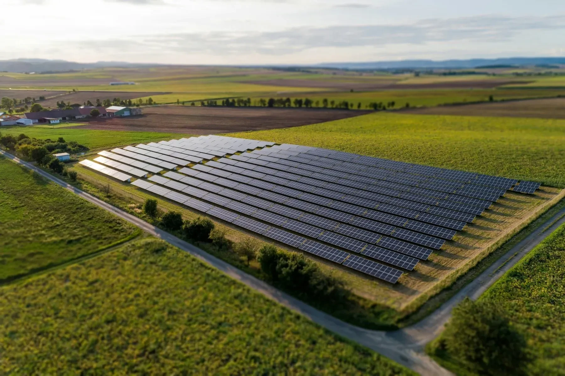Solar farm among green fields